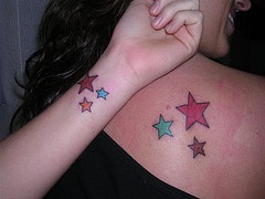 Identical stars tattoos on friends