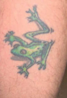 Small green frog crawling tattoo