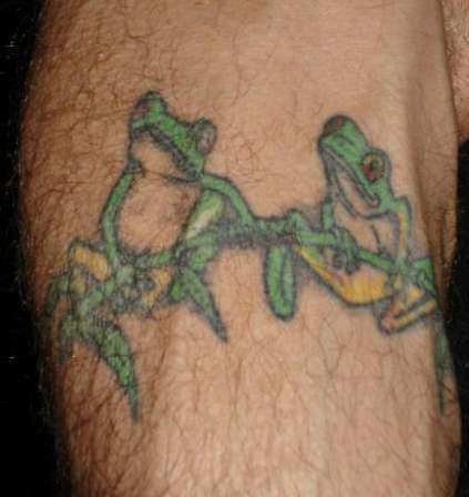 Frogs on branch tattoo