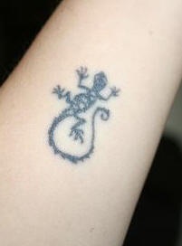 Small black lizard symbol tattoo