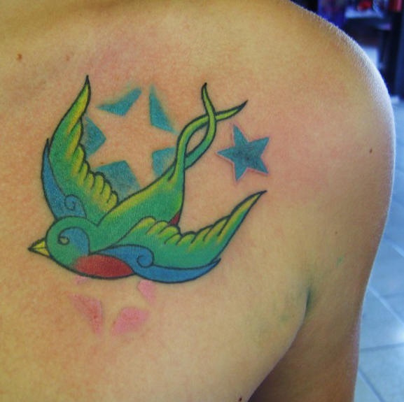 Front shoulder tattoo, green,flying swallow