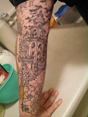 Pagoda complex black ink tattoo