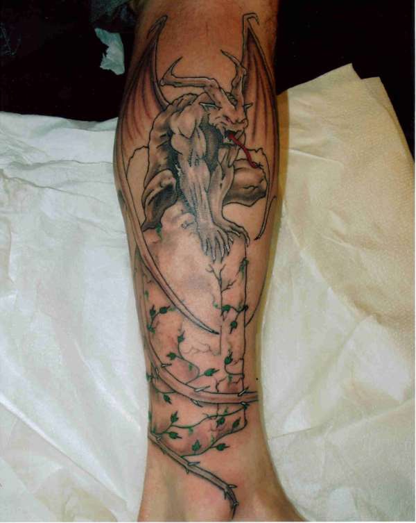 Gargoyle on tombstone with ivy  tattoo