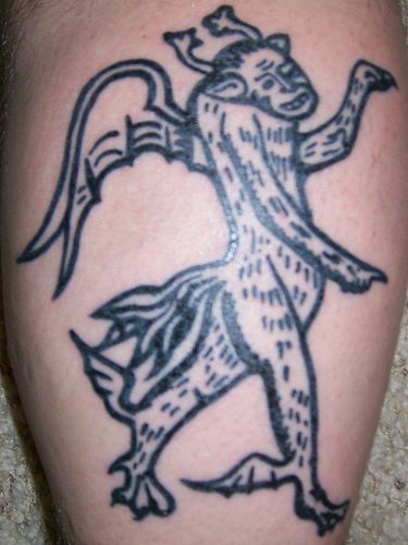Middle age horned gargoyle black ink tattoo