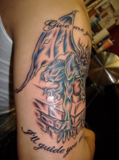 Gargoyle on chimney with writings tattoo
