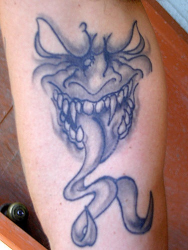 Gargoyle snake tongue tattoo