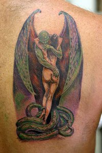 Gargoyle hugging girl in snakes colourful tattoo