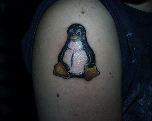 Linux penguin logo coloured tattoo