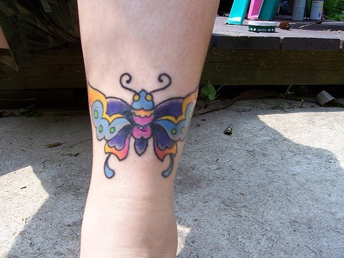 Colourful big butterfly tattoo