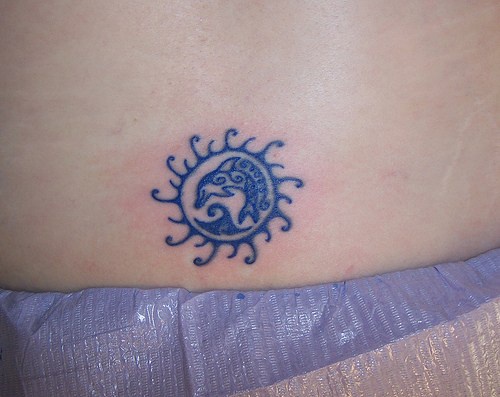 Girly dolphin symbol tattoo
