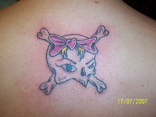 Girly skull and bones tattoo