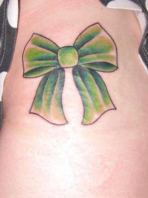 Green girly bow tattoo