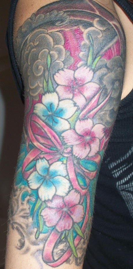 Girly colourful flowers arm tattoo