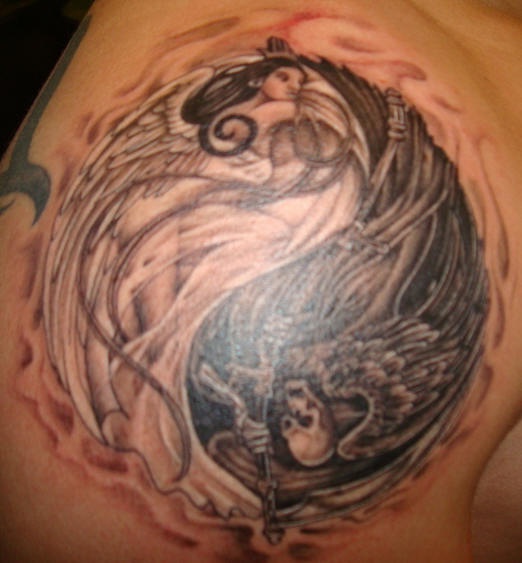 Yin yang tattoo with good and evil