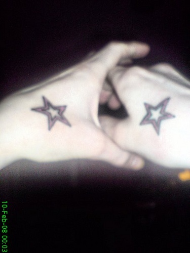 Two decorated styles stars hand tattoo