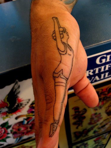 Jumping high trim gymnast hand tattoo