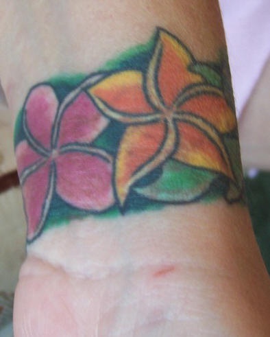 Hawaiian flower wrist tattoo