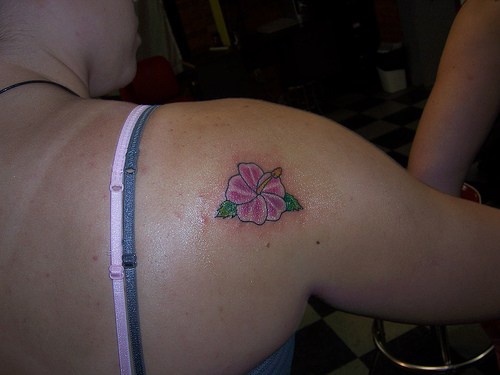 Small pink hibiscus tattoo