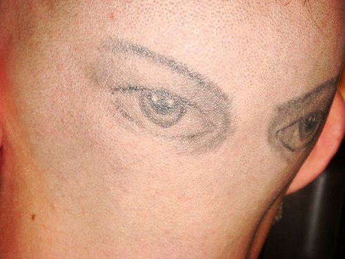 Head tattoo, very realistic colourless eyes
