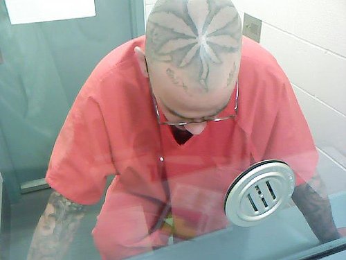 Big, black, designed marijuana leaf head tattoo