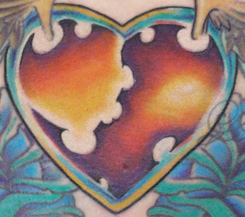 Surreal heart tattoo in colour