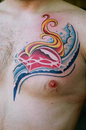 Flaming heart in waves tattoo