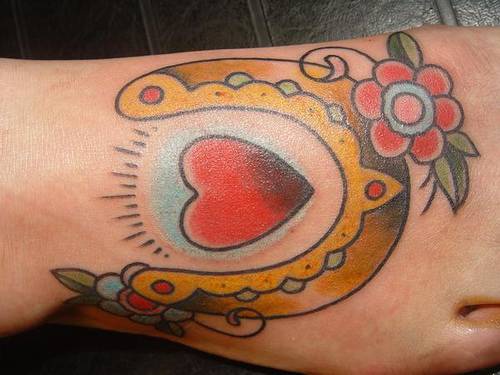 Heart with horseshoe and flower tattoo
