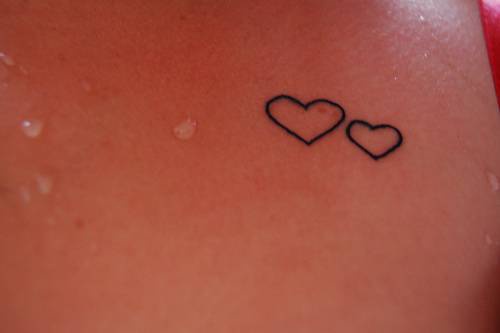 Two black line hearts tattoo