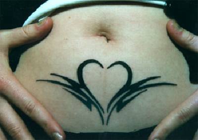 Black tribal heart tattoo