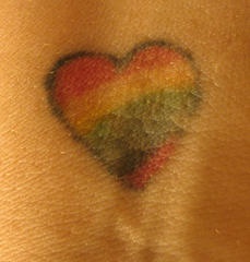 Colourful fag heart symbol tattoo