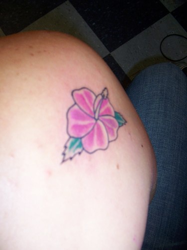 Minimalitic coloured hibiscus tattoo
