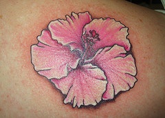 Soft pink hibiscus flower tattoo