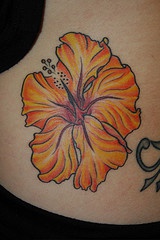 Yellow hibiscus flower tattoo
