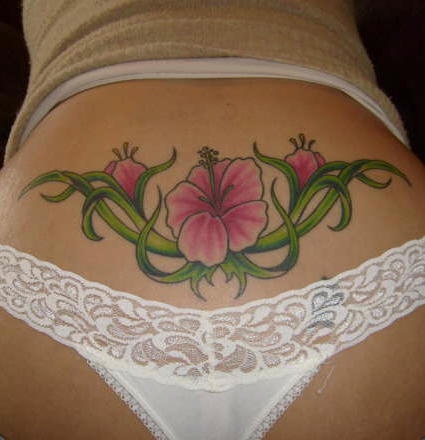 Hibiscus flowers lower back tattoo