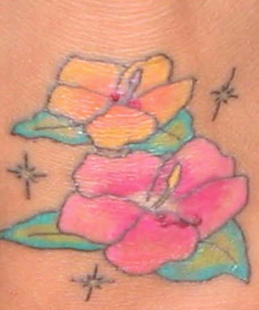 Cartoonish hibiscus flowers tattoo