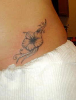 Black flower of hibiscus tattoo