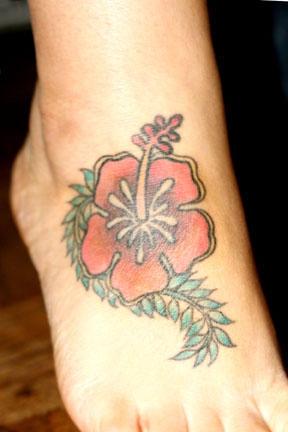 Elegant hibiscus tattoo on foot