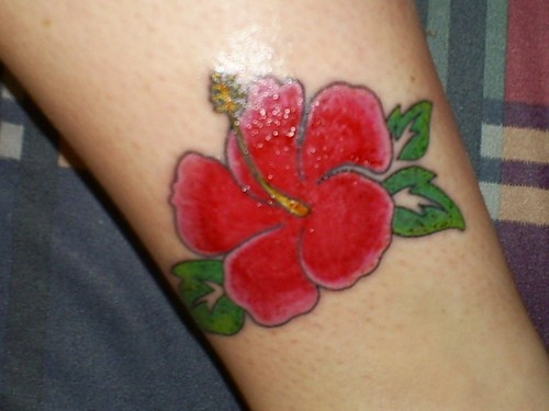 Red hibiscus tattoo