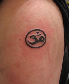Om symbol in circle tattoo