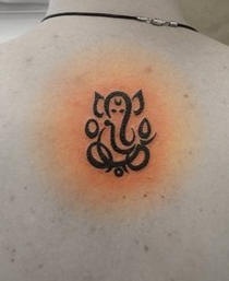 Minimalistic ganesha deity tattoo