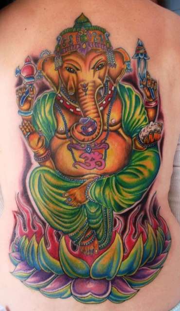 Golden ganesha in flaming lotus tattoo