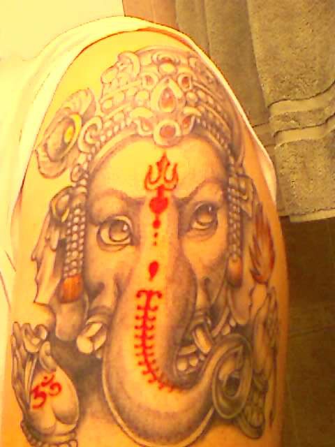Ganesha with mantras on it tattoo