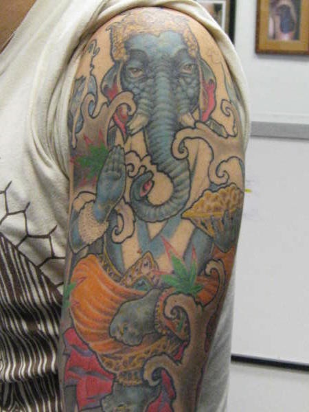 Surreal and colourful ganesha tattoo