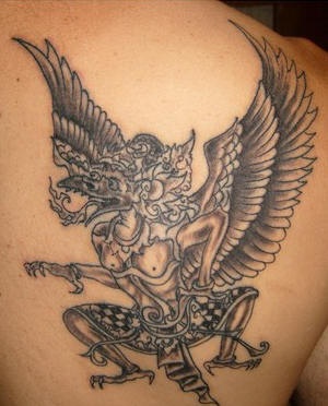 Winged hindu deity tattoo