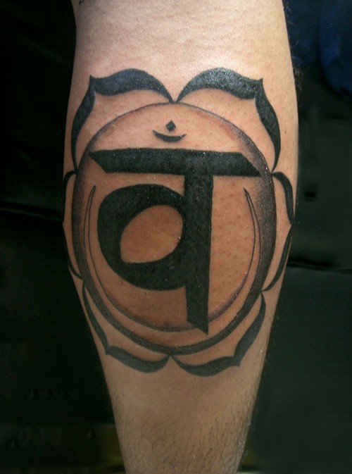 Hindu symbol in lotus  tattoo