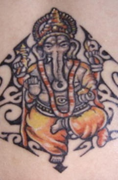 Dancing ganesha in tribal tracery tattoo