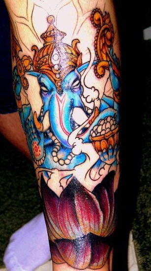 Colourful ganesha hindu deity tattoo on forearm