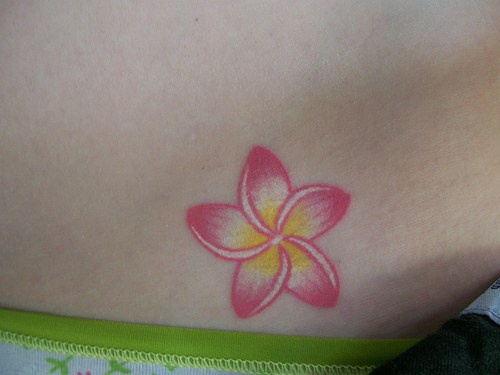 Beautiful, pink, delicate flower hip tattoo