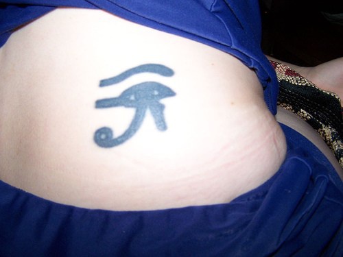 Black, little, hieroglyph, personal meaning hip tattoo