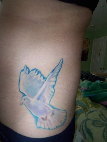 Flying, blue, clear pigeon hip tattoo